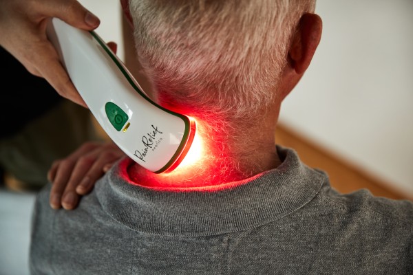 Photo of the device being used on a person's neck